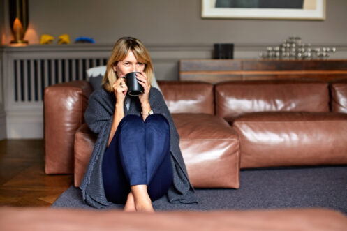 Woman enjoying heated home in Coral Springs, FL